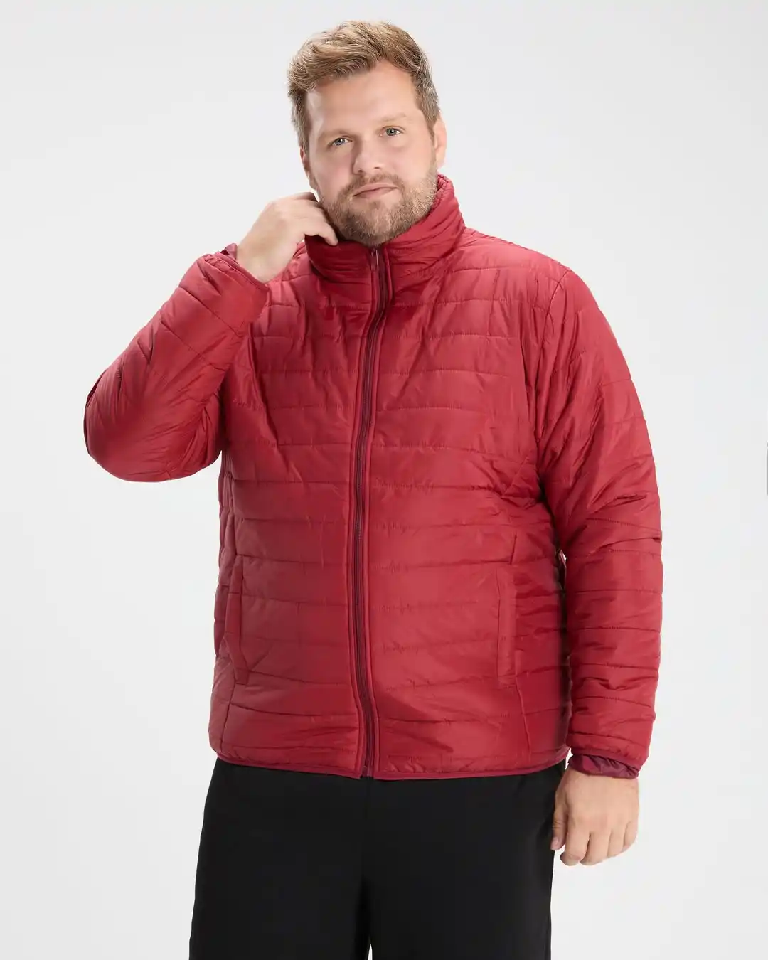 21 Winter Outfit Ideas for Plus Size Men That Actually Work 5 5. Red Quilted Puffer Jacket with Black Trousers