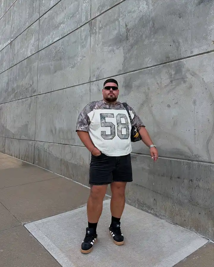 12 T-shirt Outfit Ideas for Plus Size Men That Actually Work 7 Oversized Jersey Tee, Balanced Out With Fitted Bottoms