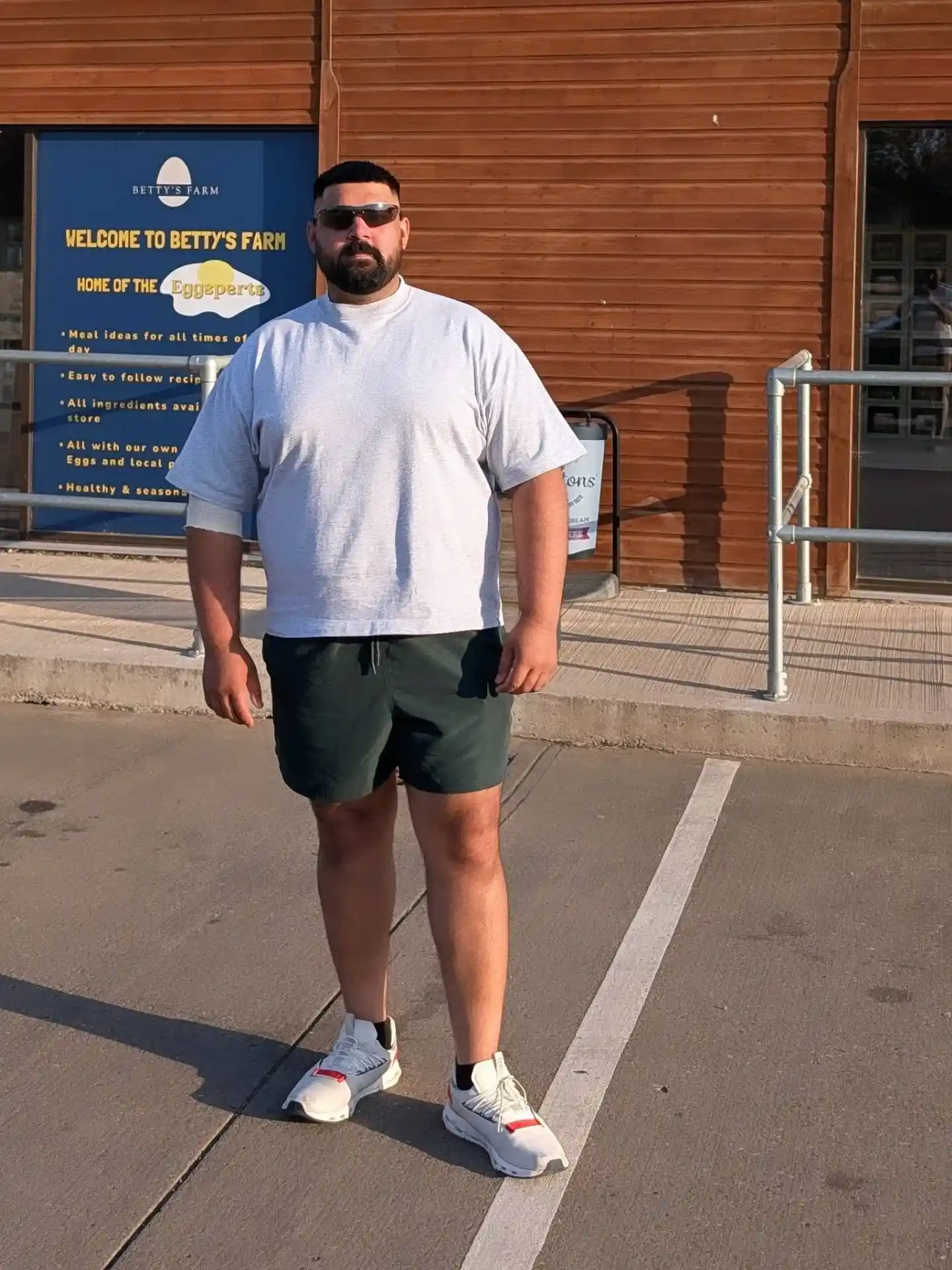 15 Effortless Outfit Ideas for Plus Size Men Real Men Swear By 10 9. Heather Gray Boxy Tee and Dark Green Shorts for a Warm Weather Reset