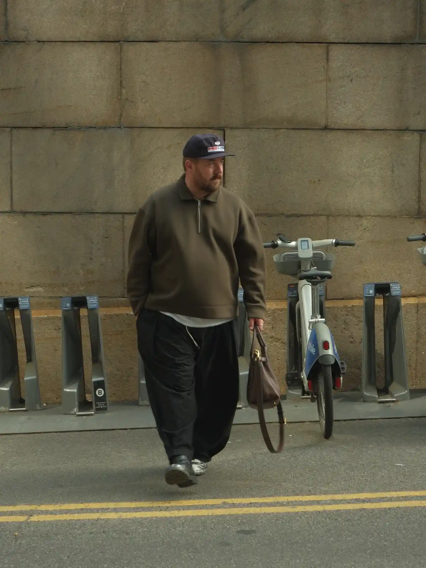 15 Effortless Outfit Ideas for Plus Size Men Real Men Swear By 7 6. Olive Quarter Zip and Balloon Pants with a Leather Shoulder Bag