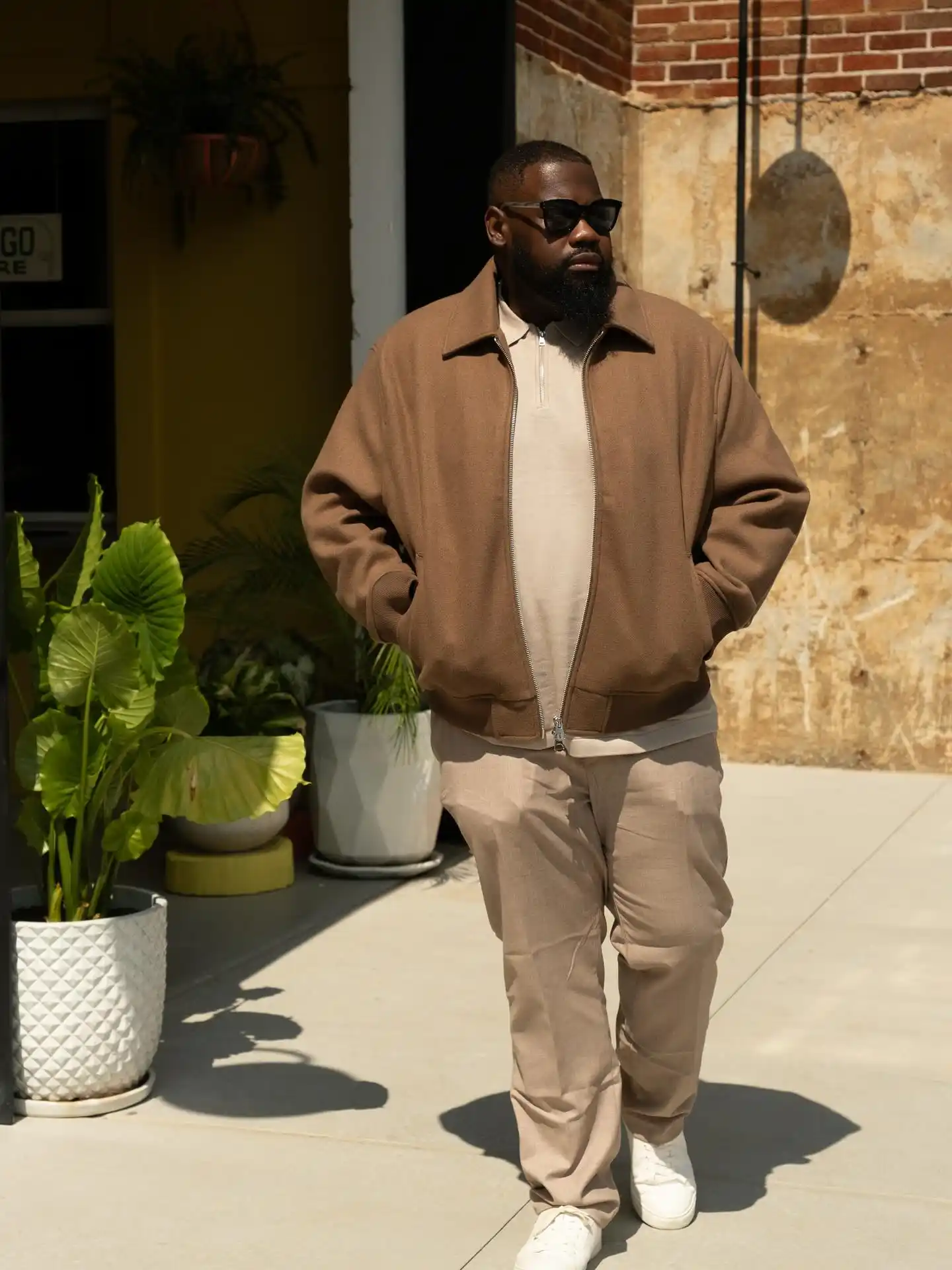 18 Earth Tone Outfits for Plus Size Men You Need to Try 5 4. Tonal Brown and Sand with a Zip Bomber Jacket