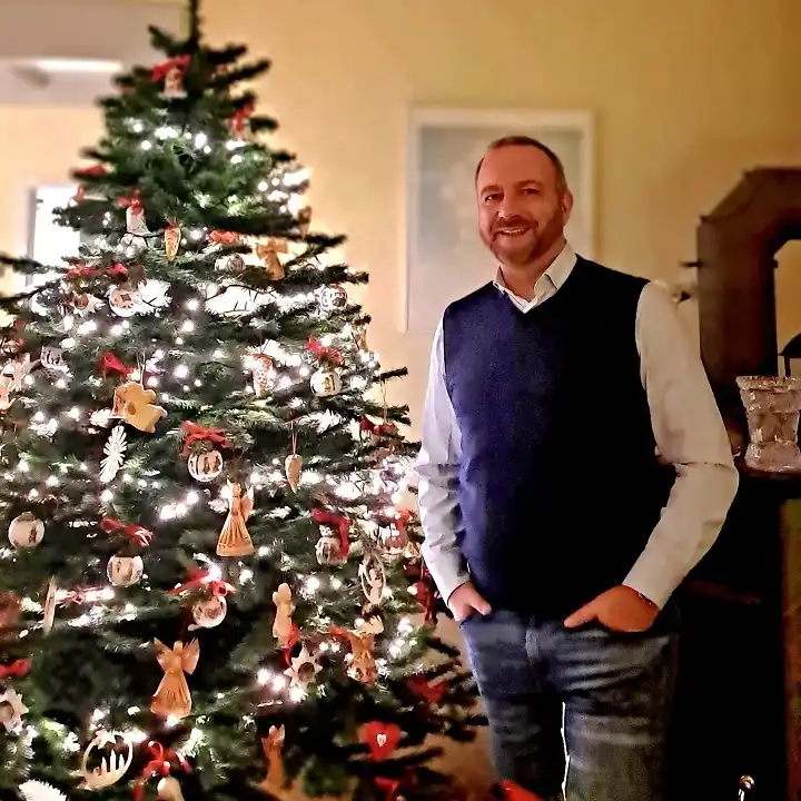 15 Christmas Party Outfits for Plus Size Men That Actually Work 6 Navy Sweater Vest Over a Pale Dress Shirt