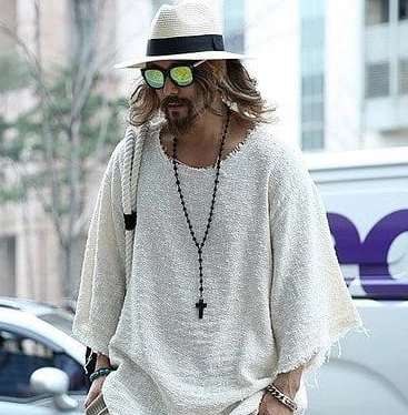 The Frayed-Hem Poncho Sweater That Makes Boho Look Effortless in the Heat