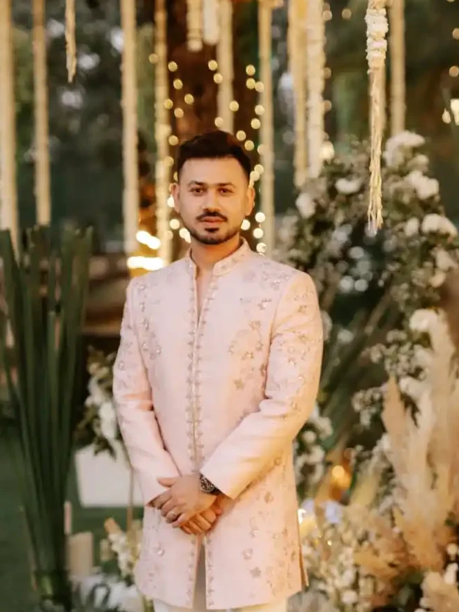 7. Blush Pink Sherwani with White Pants