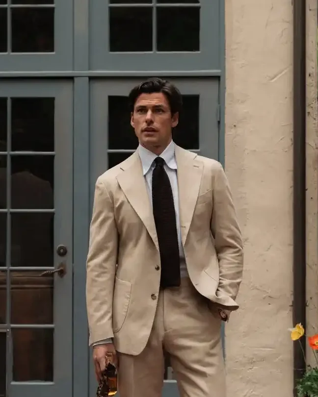2. Tan Suit With a Knit Tie, Barefoot Look